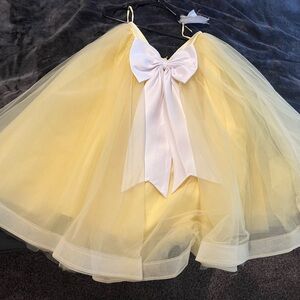 Custom yellow tulle skirt with white bow.
